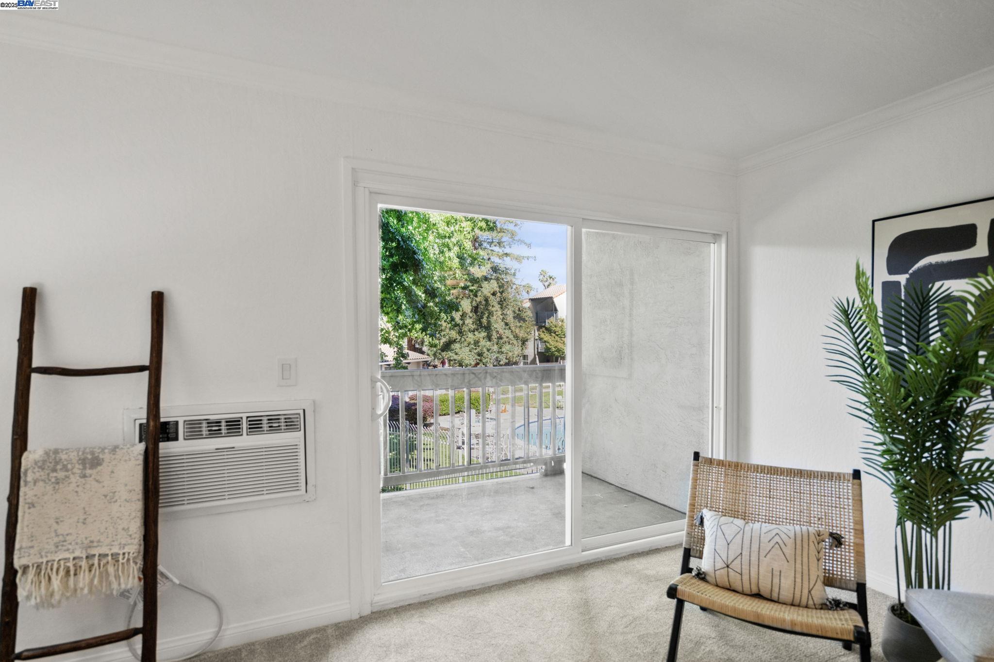 1085 Murrieta Boulevard, Unit 222 Livermore, CA 94550 - Photo 10 of 25 a living room with furniture and a potted plant