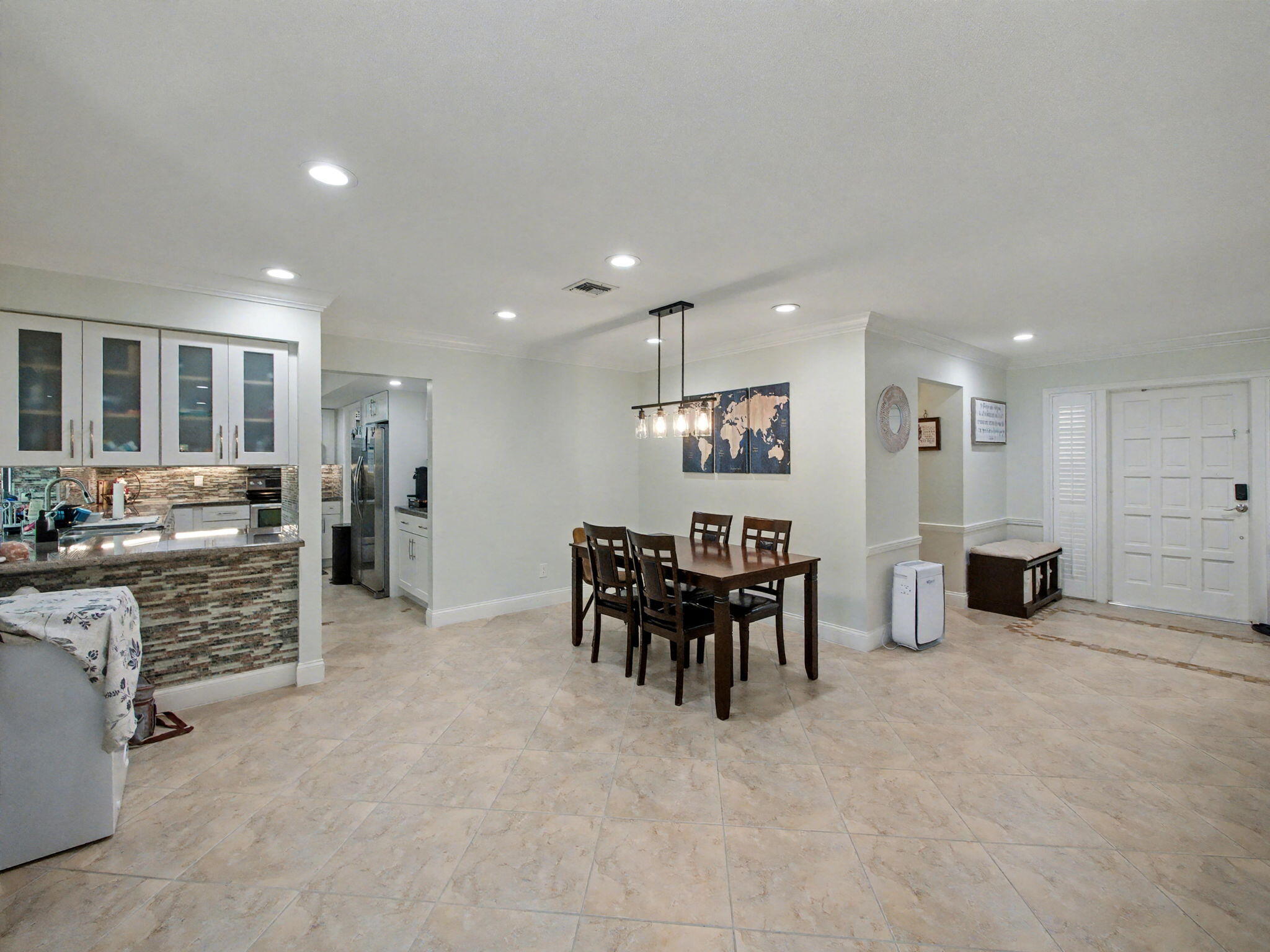 720 Muirfield Circle Atlantis, FL 33462 - Photo 19 of 20 a view of kitchen with furniture and windows