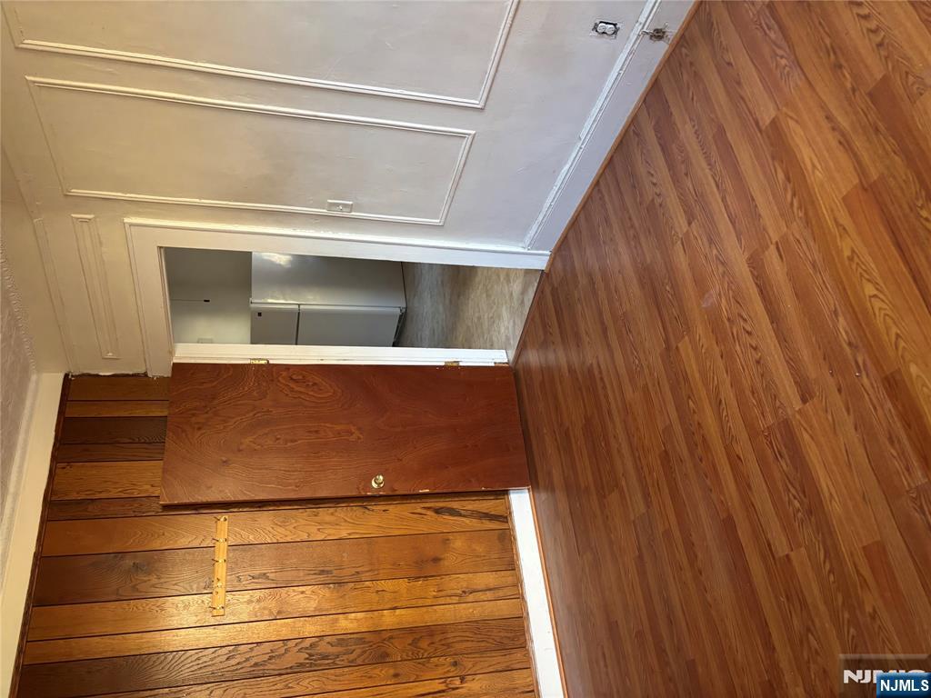 86 Center Street, Unit 2R Clifton, NJ 07011 - Photo 8 of 8 a view of wooden floor and closet in a room