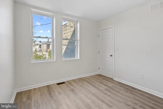 an empty room with windows