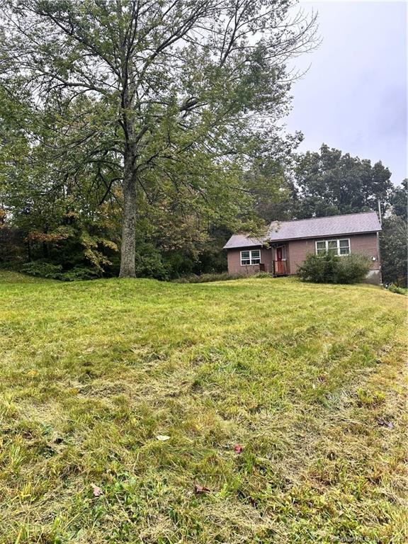 81 Halls Hill Road Killingly, CT 06239 - Photo 1 of 1 a view of a large pool with lawn chairs and a big yard