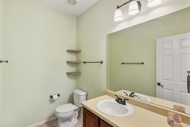 a spacious bedroom with a bed and a window