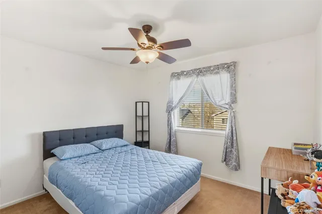 a bedroom with furniture and a chandelier