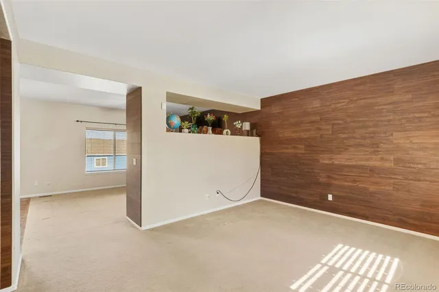 a kitchen with a stove sink and cabinets