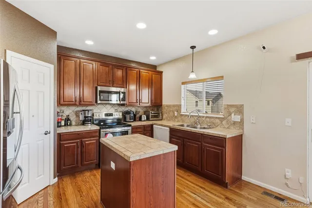 a kitchen that has a cabinets counter space and appliances