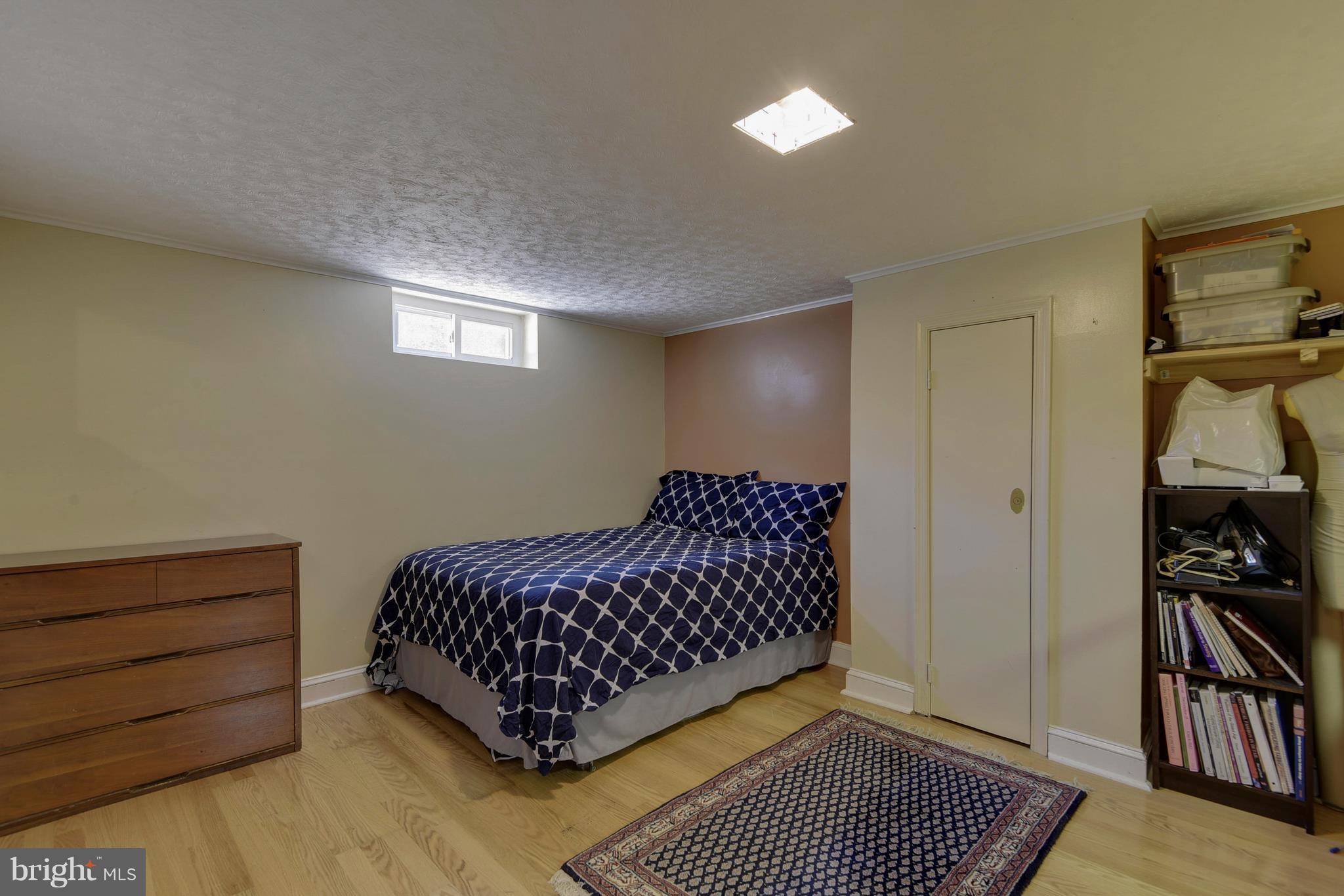 4412 Bennion Road Silver Spring, MD 20906 - Photo 20 of 29 a bedroom with a bed and wooden floor