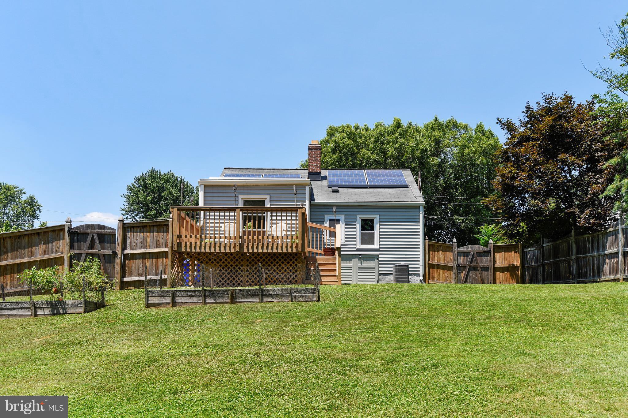 4412 Bennion Road Silver Spring, MD 20906 - Photo 3 of 29 a view of a house with a backyard porch and sitting area