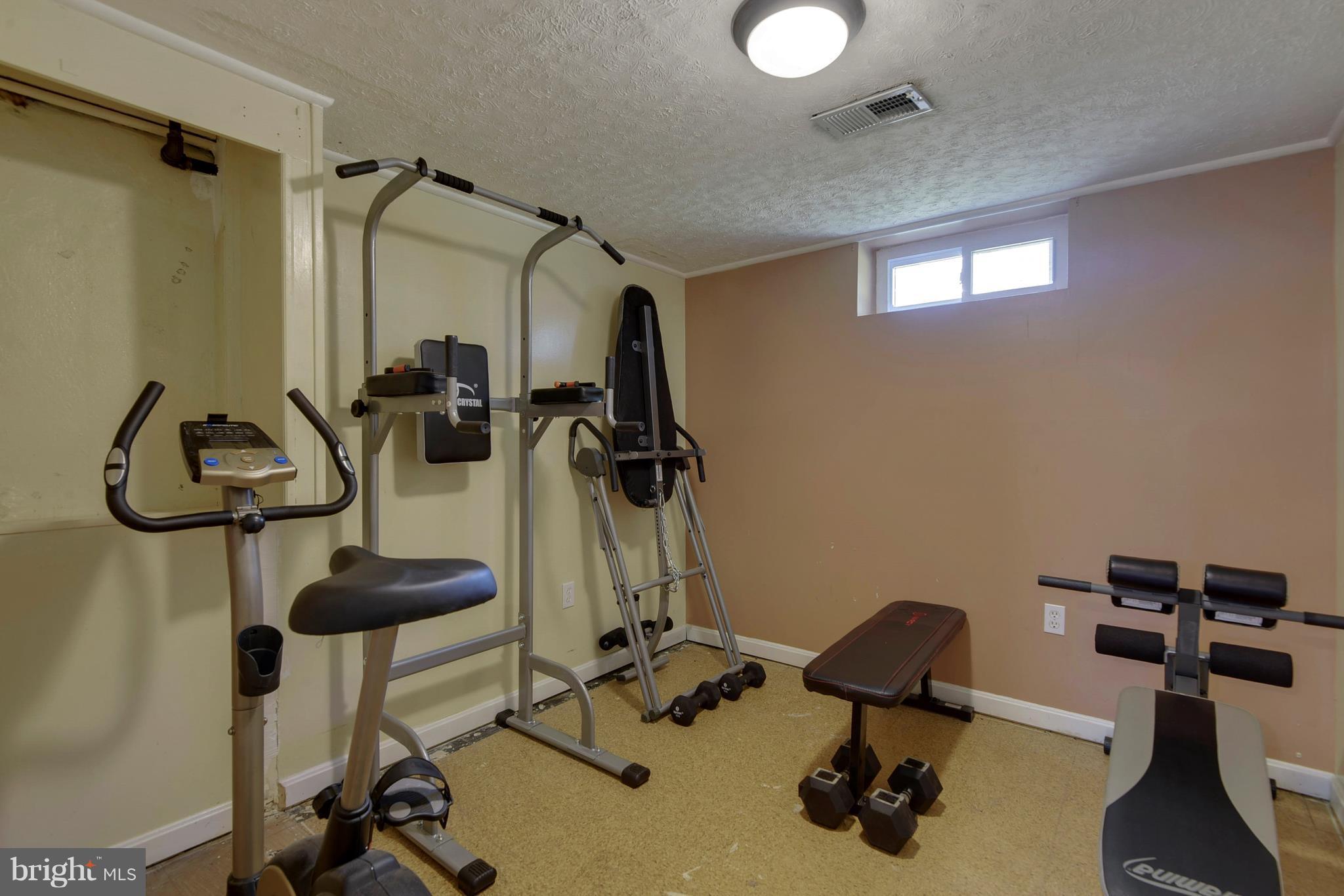 4412 Bennion Road Silver Spring, MD 20906 - Photo 22 of 29 a view of a room with gym equipment