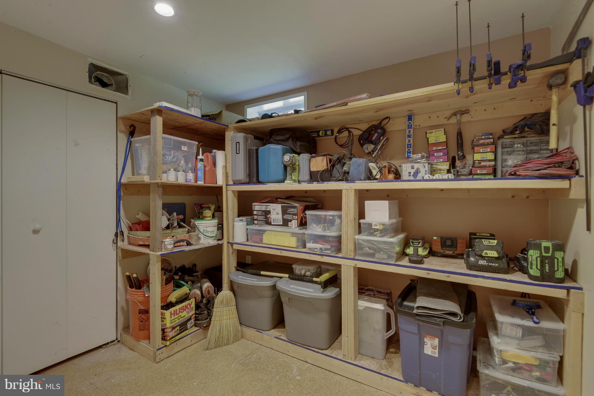 4412 Bennion Road Silver Spring, MD 20906 - Photo 25 of 29 a room with wooden cabinets and storage