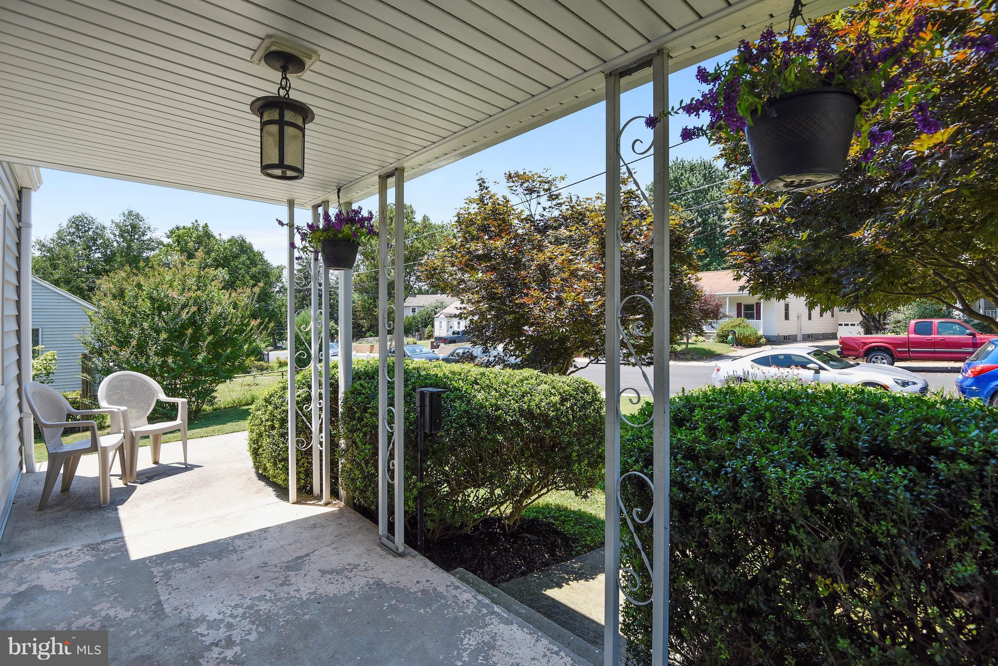 4412 Bennion Road Silver Spring, MD 20906 - Photo 27 of 29 a view of a patio with table and chairs potted plants
