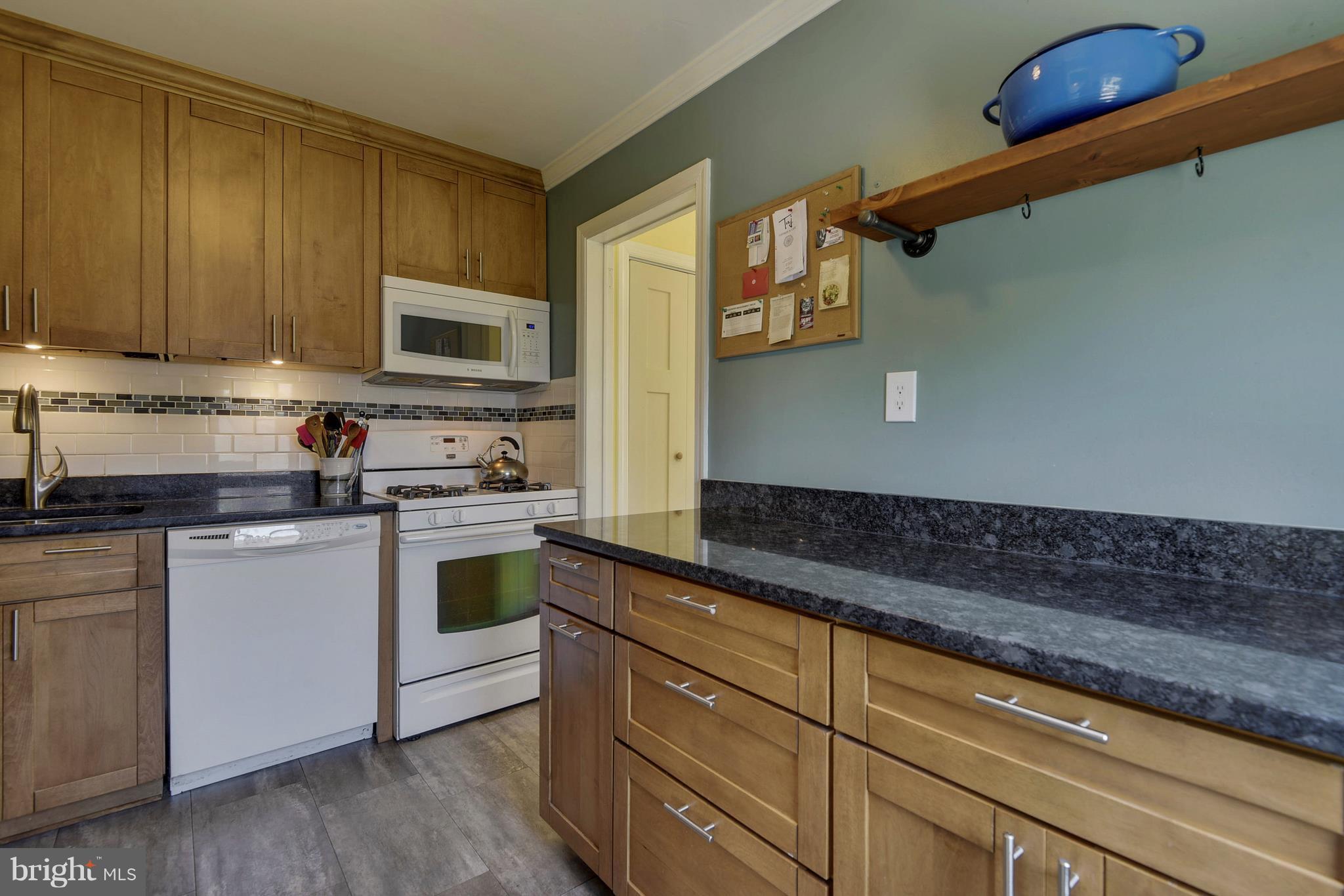 4412 Bennion Road Silver Spring, MD 20906 - Photo 8 of 29 a kitchen with granite countertop cabinets stainless steel appliances and a sink