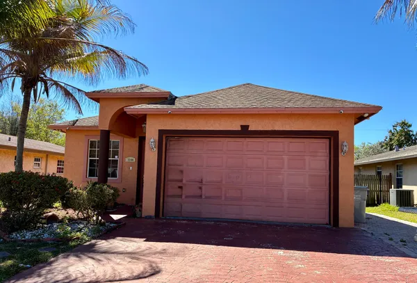 a view of a house with a small yard