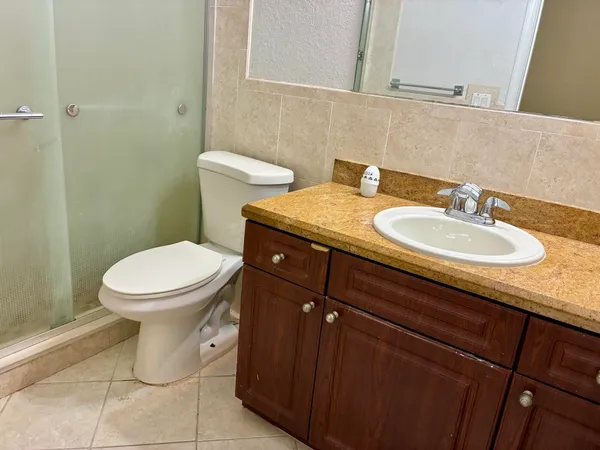 a bathroom with a sink and mirror
