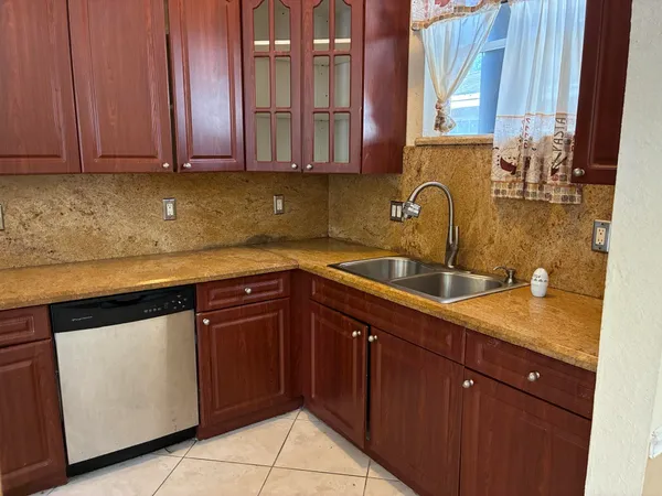 a kitchen with a sink and cabinets