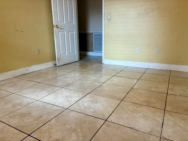 a bathroom with a granite countertop sink a toilet and bathtub