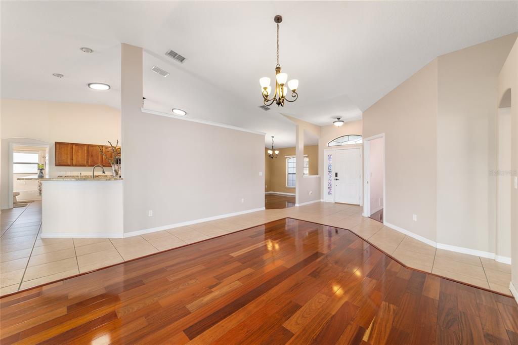 4037 Southeast 40th Street Ocala, FL 34480 - Photo 15 of 38 a view of a hallway with wooden floor