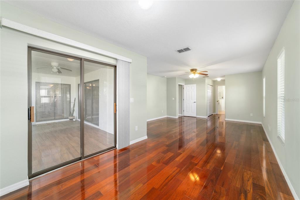 4037 Southeast 40th Street Ocala, FL 34480 - Photo 23 of 38 a view of a room with wooden floor and window