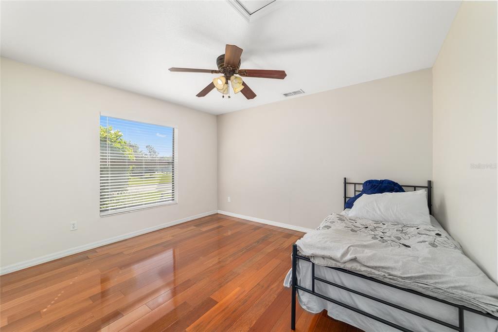 4037 Southeast 40th Street Ocala, FL 34480 - Photo 29 of 38 a bedroom with a bed and a window