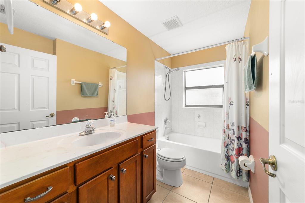 4037 Southeast 40th Street Ocala, FL 34480 - Photo 30 of 38 a bathroom with a sink a toilet and shower