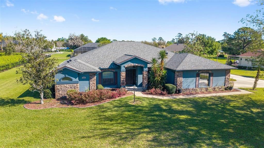 4037 Southeast 40th Street Ocala, FL 34480 - Photo 3 of 38 front view of a house with a yard