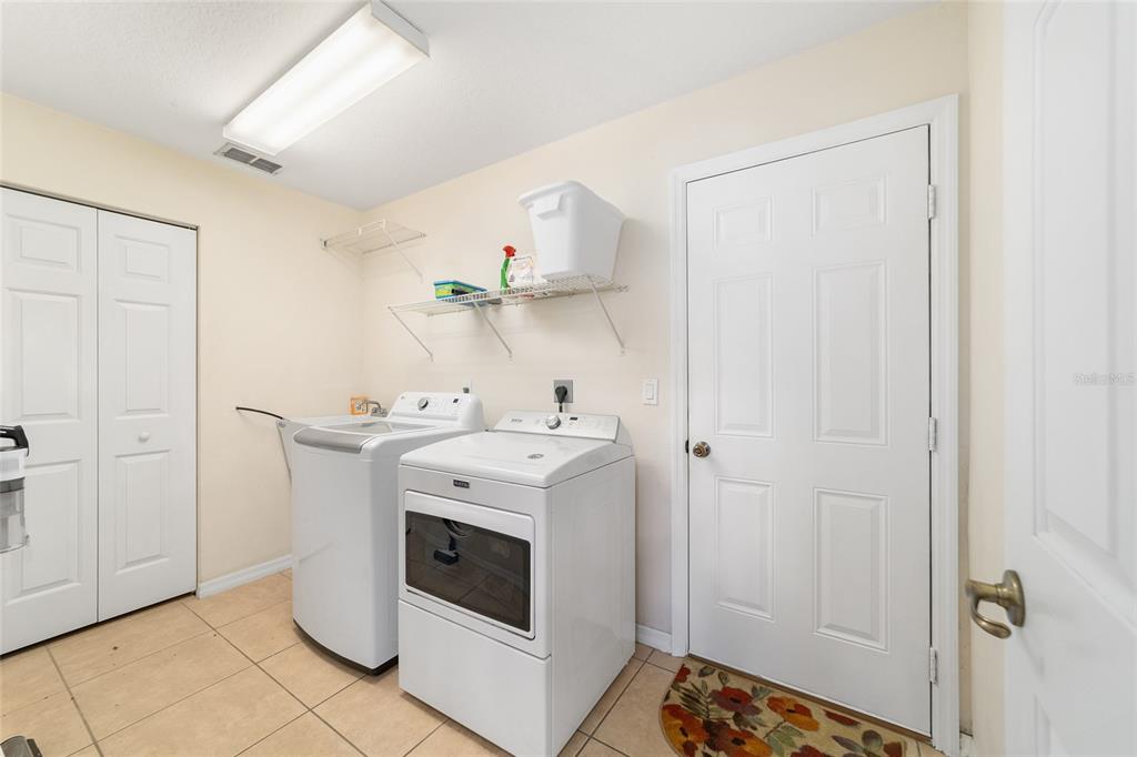 4037 Southeast 40th Street Ocala, FL 34480 - Photo 34 of 38 a utility room with dryer and washer
