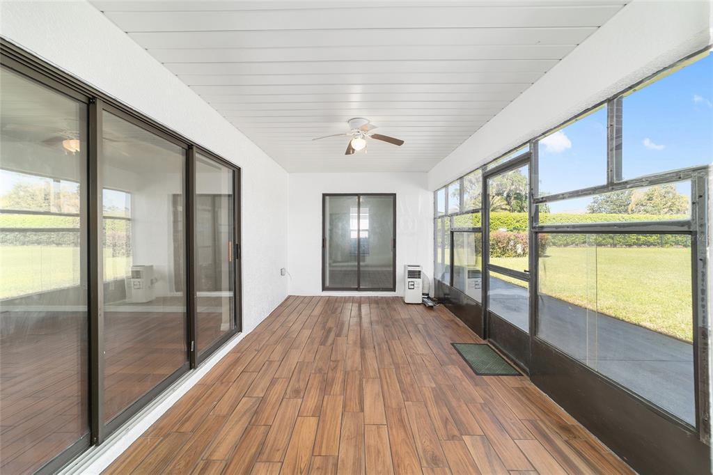 4037 Southeast 40th Street Ocala, FL 34480 - Photo 36 of 38 a view of an empty room with wooden floor and a window