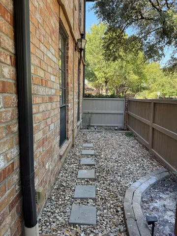 a view of a yard from a balcony