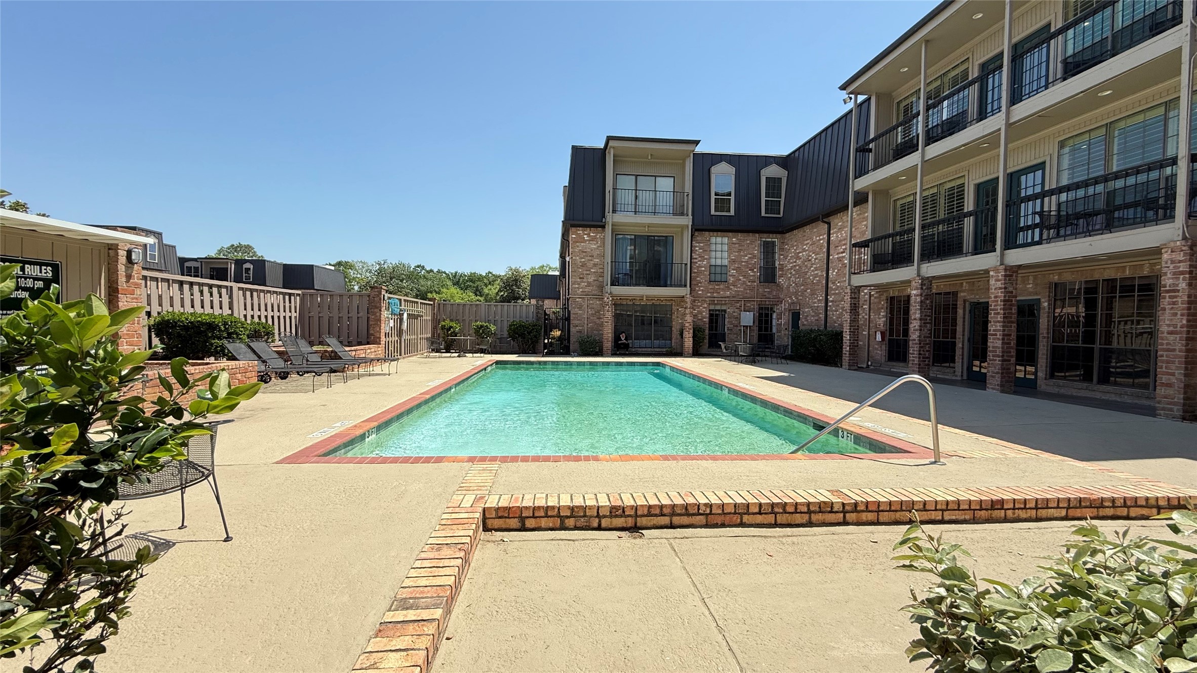 2425 Underwood Street, Unit 142 Houston, TX 77030 - Photo 2 of 38 a view of a building with a swimming pool