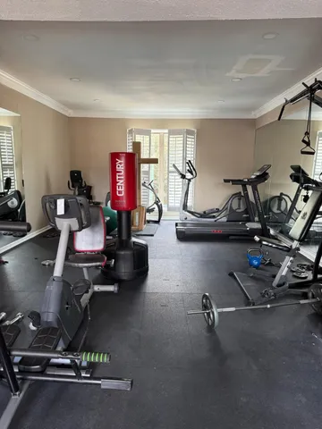 a view of a chairs and table in the balcony