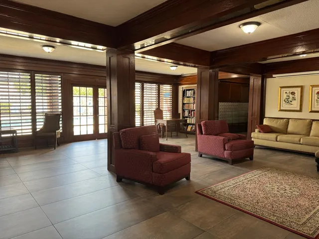 a view of livingroom with furniture wooden floor and windows