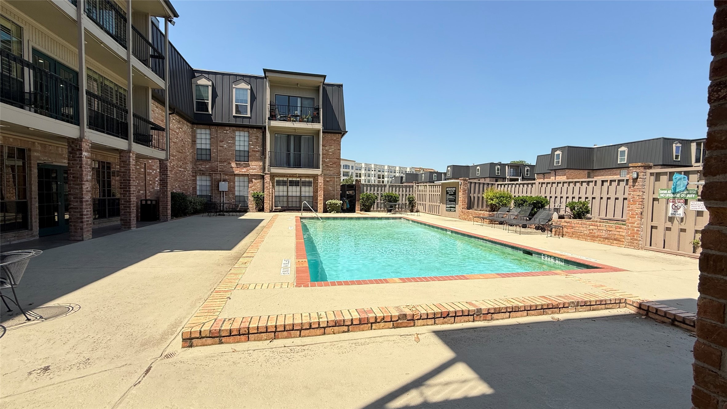2425 Underwood Street, Unit 142 Houston, TX 77030 - Photo 33 of 38 a view of pool with outdoor seating and city view