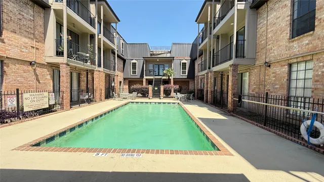 a view of a patio with table and chairs and potted plants