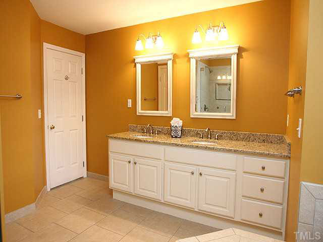 8405 Evans Mill Place Raleigh, NC 27613 - Photo 16 of 25 The dual vanity has been raised to comfort height and accented with a granite counter. Master Bath/Spa