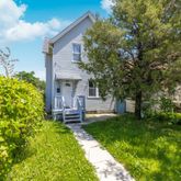 a view of a house with a back yard