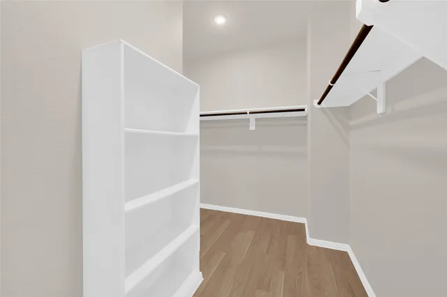 a view of an empty walk in closet