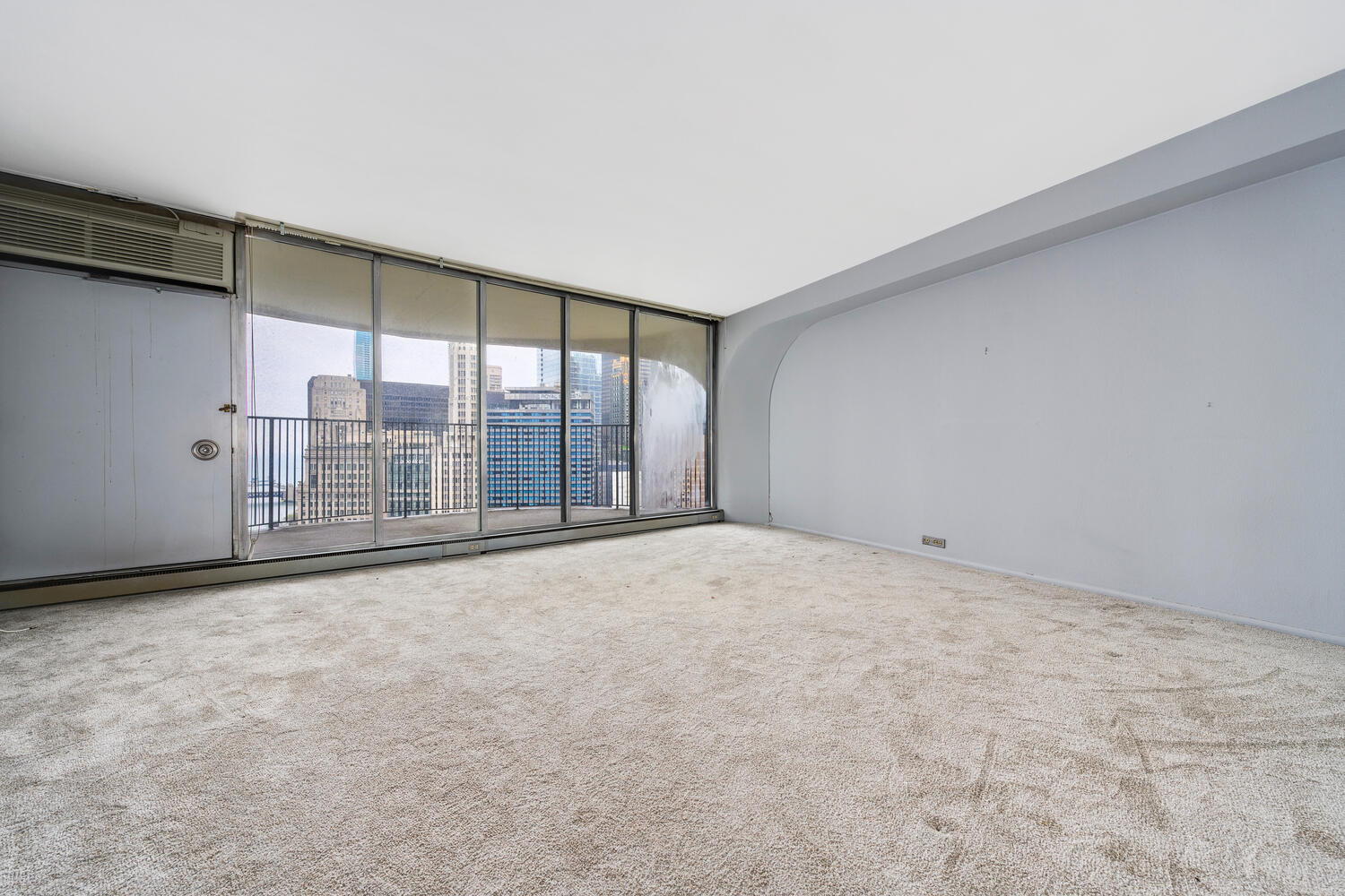 300 North State Street, Unit 3231 Chicago, IL 60654 - Photo 2 of 19 an empty room with windows