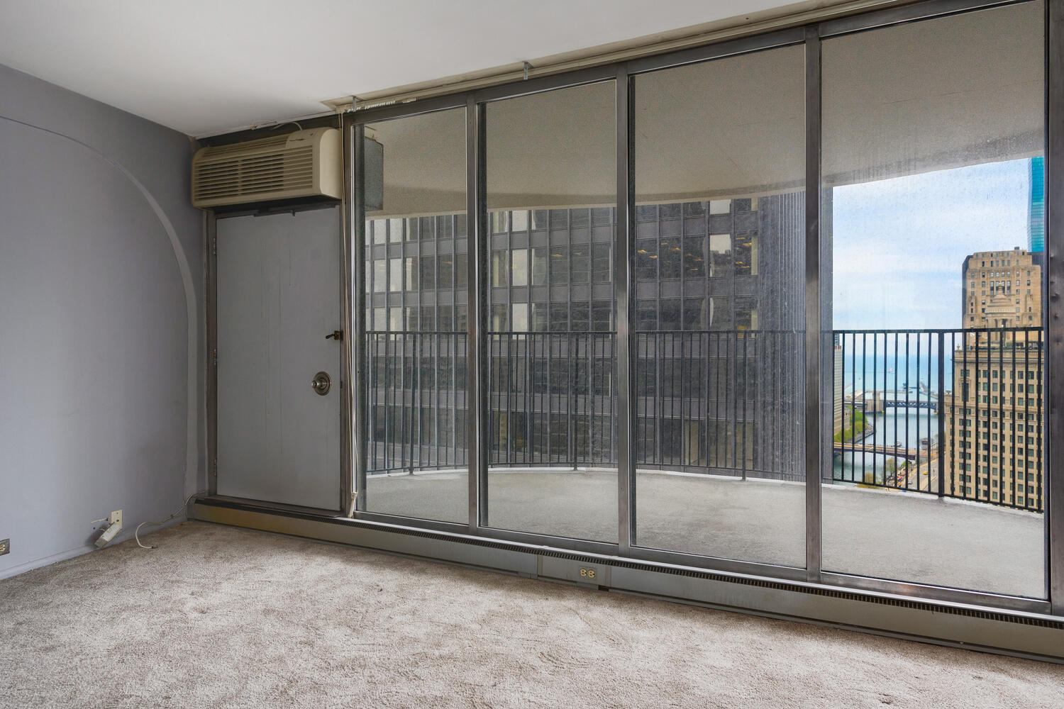 300 North State Street, Unit 3231 Chicago, IL 60654 - Photo 4 of 19 a view of a room with sliding glass door