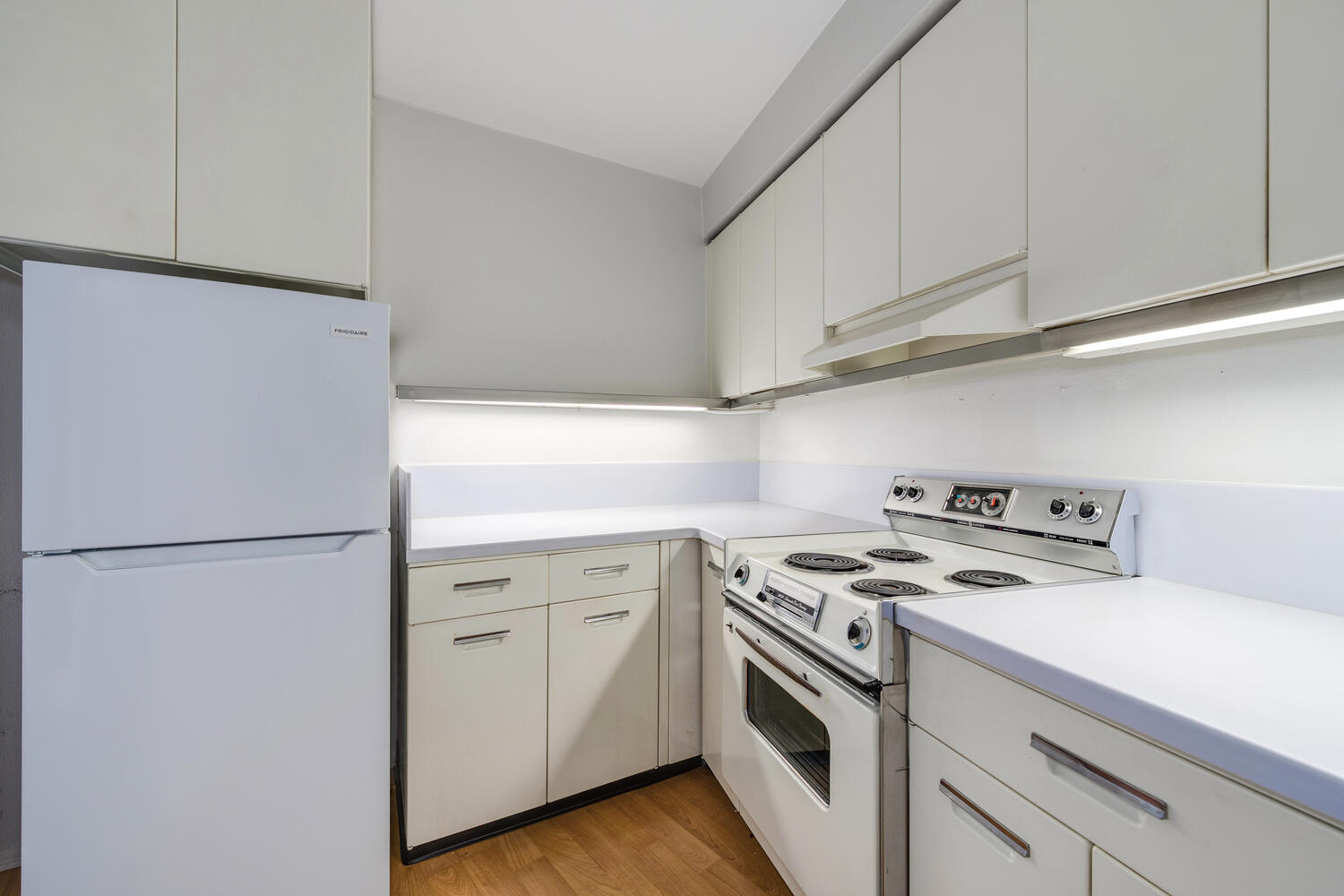 300 North State Street, Unit 3231 Chicago, IL 60654 - Photo 9 of 19 a white refrigerator freezer sitting inside of a kitchen