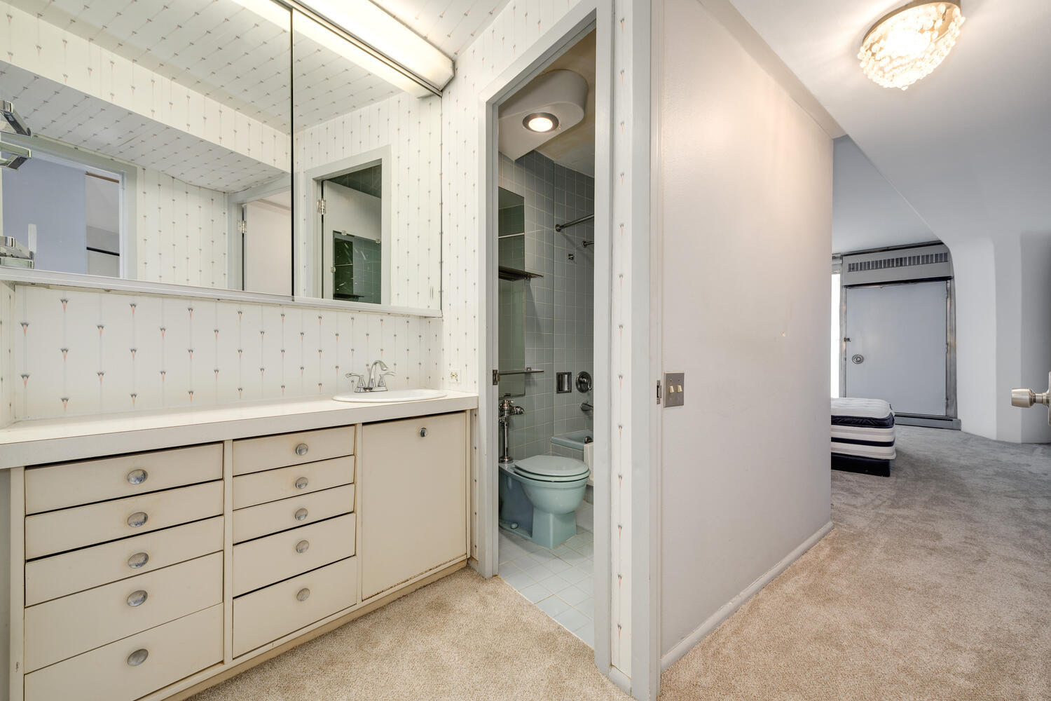 300 North State Street, Unit 3231 Chicago, IL 60654 - Photo 10 of 19 a bathroom with a sink and a mirror