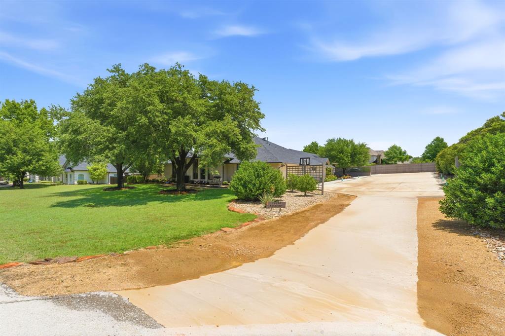 10390 Ridgecrest Street Frisco, TX 75033 - Photo 34 of 40 a view of a garden with a building in the background