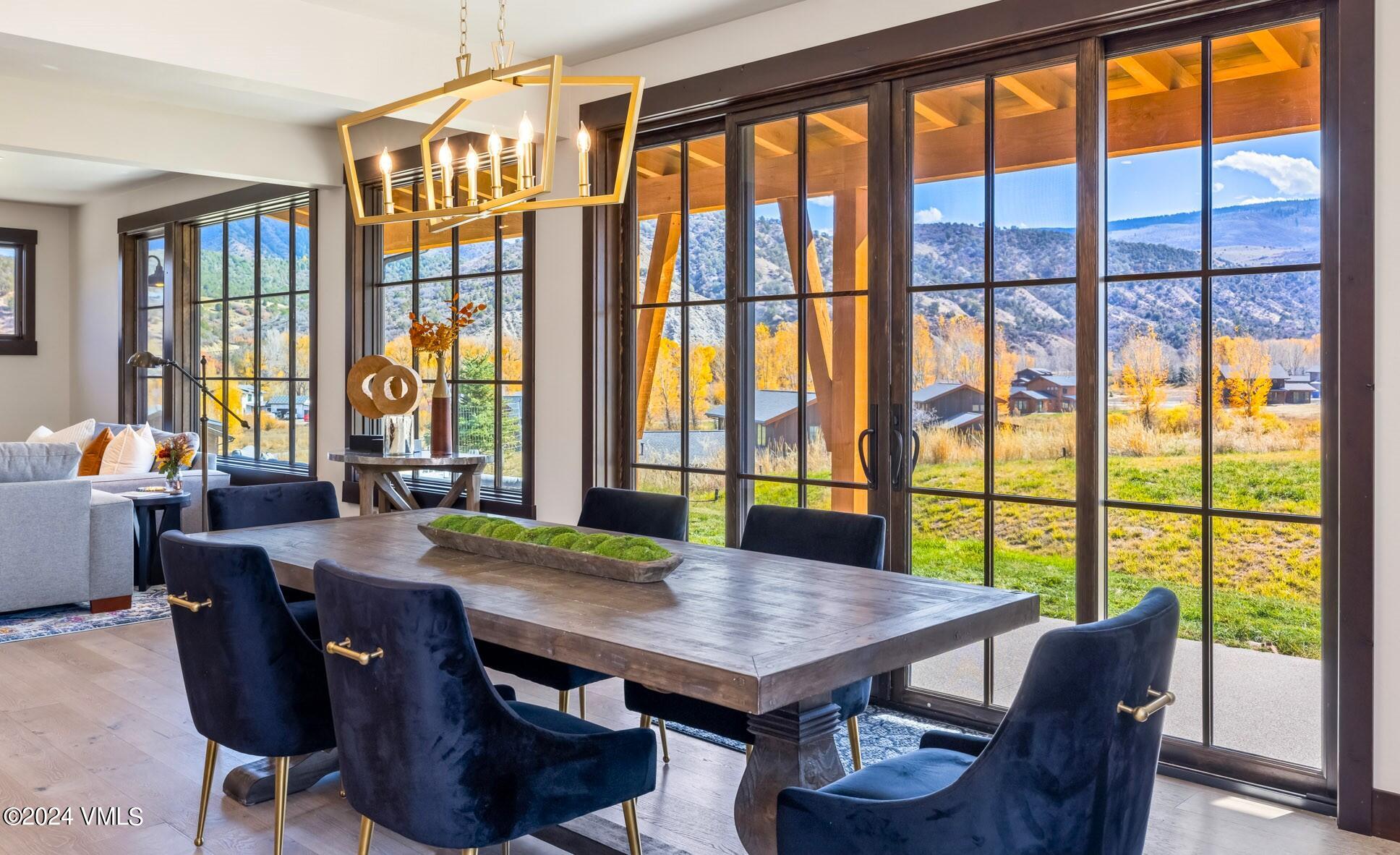 448 Hunters View Lane Eagle, CO 81631 - Photo 12 of 35 a view of a dining room with furniture window and wooden floor
