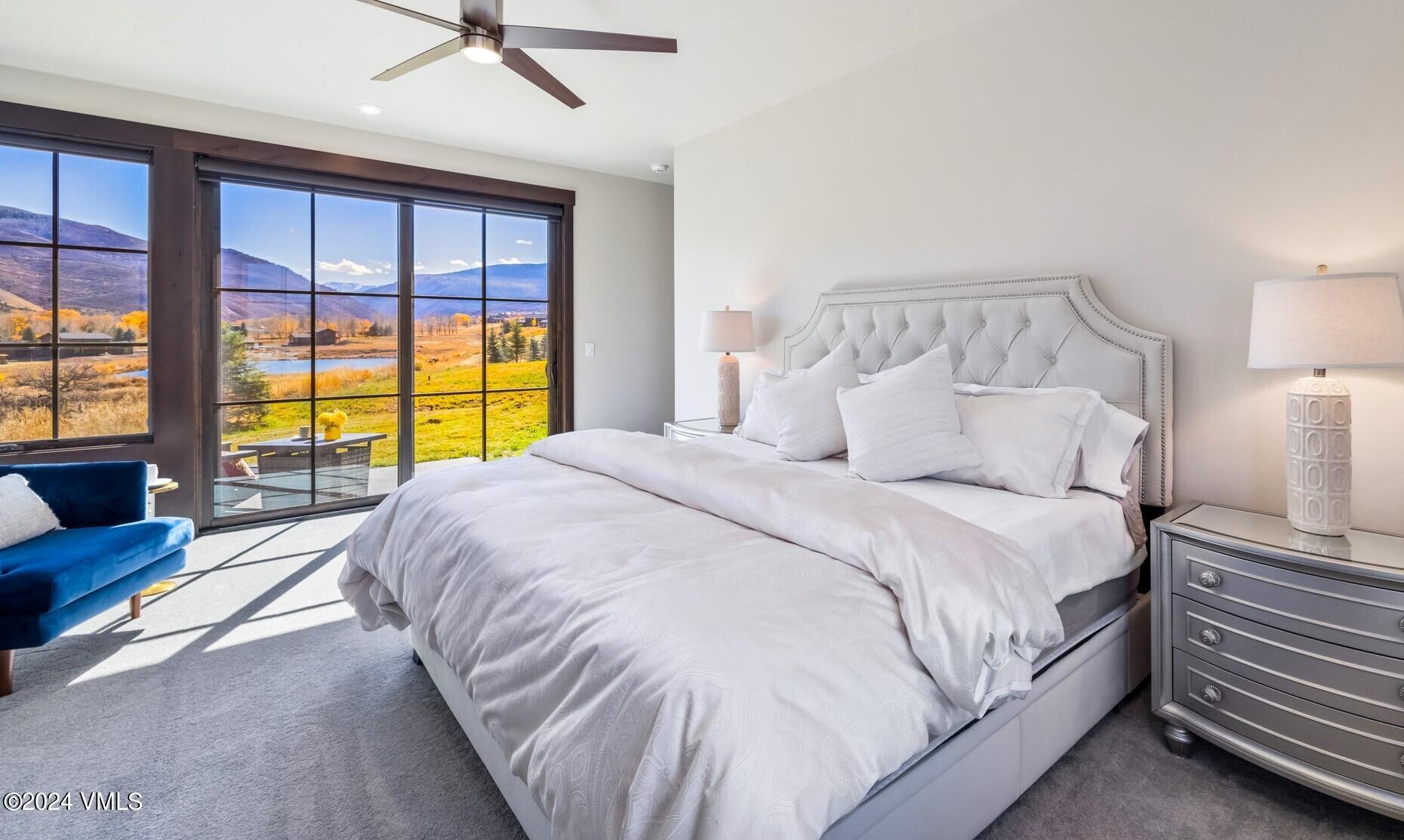 448 Hunters View Lane Eagle, CO 81631 - Photo 19 of 35 a large bed sitting in a bedroom next to a window