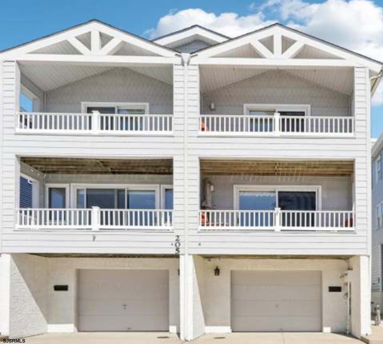 205 4th Street North, Unit 205B Brigantine, NJ 08203 - Photo 1 of 19 a view of a house with a balcony