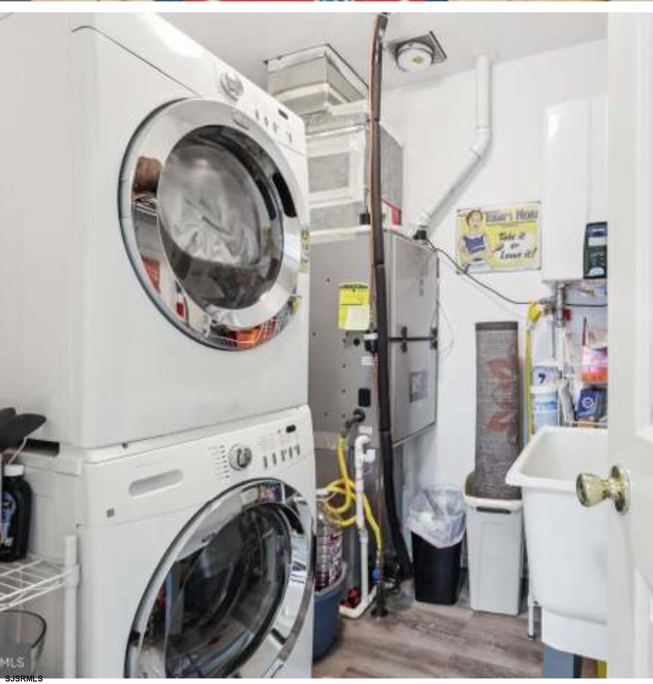 205 4th Street North, Unit 205B Brigantine, NJ 08203 - Photo 14 of 19 a view of a storage & utility room with washer and dryer