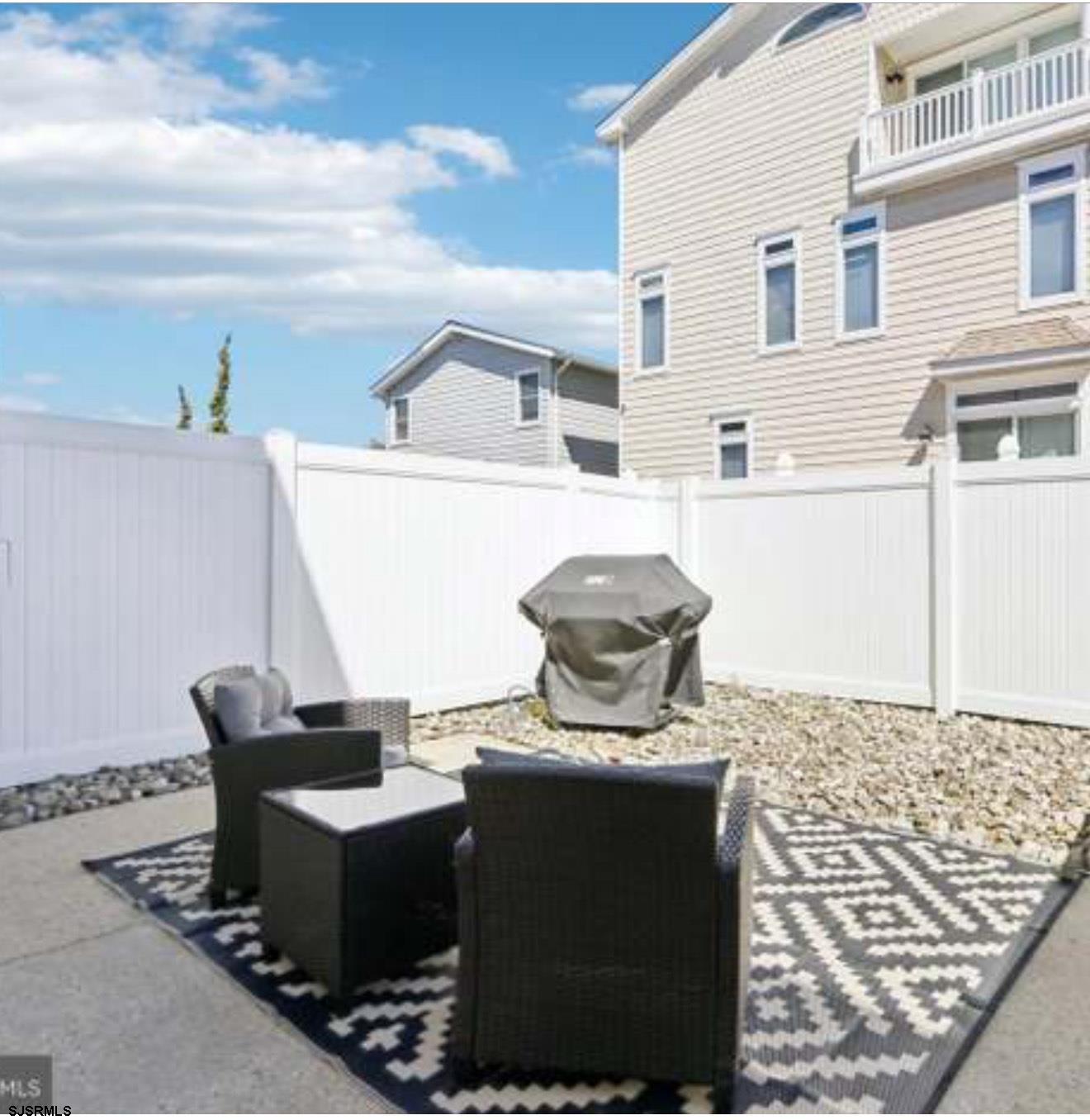 205 4th Street North, Unit 205B Brigantine, NJ 08203 - Photo 17 of 19 a living room with a couch