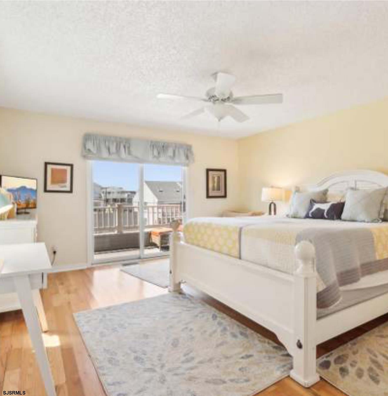 205 4th Street North, Unit 205B Brigantine, NJ 08203 - Photo 6 of 19 a large white bed in a white room