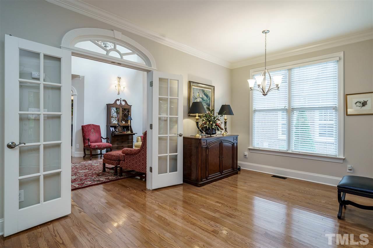 1901 Torrington Street Raleigh, NC 27615 - Photo 15 of 30 a living room with furniture and a chandelier