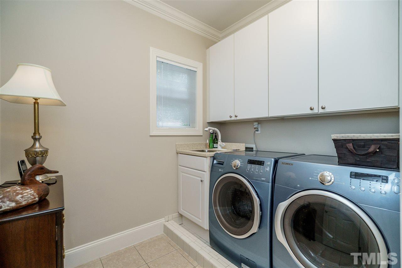1901 Torrington Street Raleigh, NC 27615 - Photo 20 of 30 a view of storage and utility room with washer and dryer