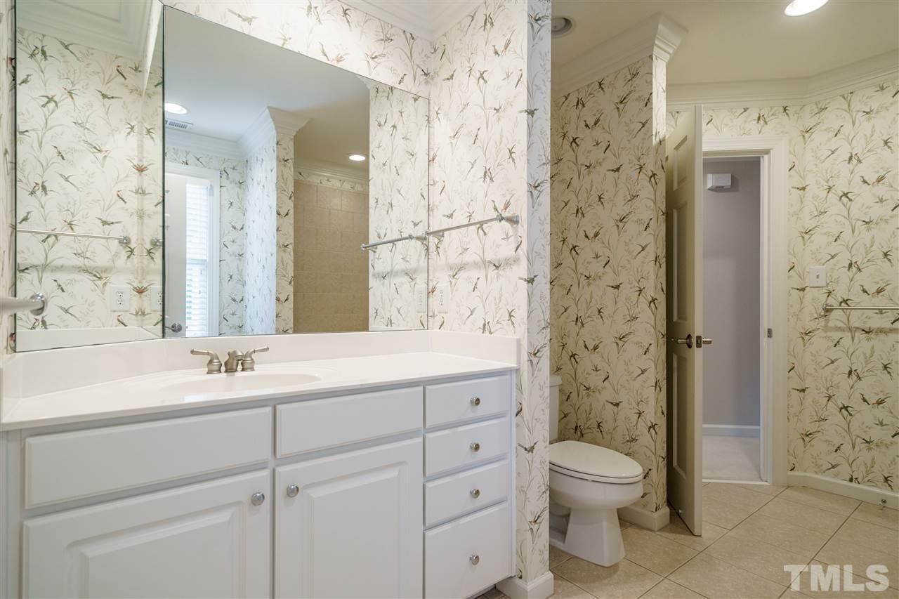 1901 Torrington Street Raleigh, NC 27615 - Photo 25 of 30 a bathroom with a sink a toilet and shower