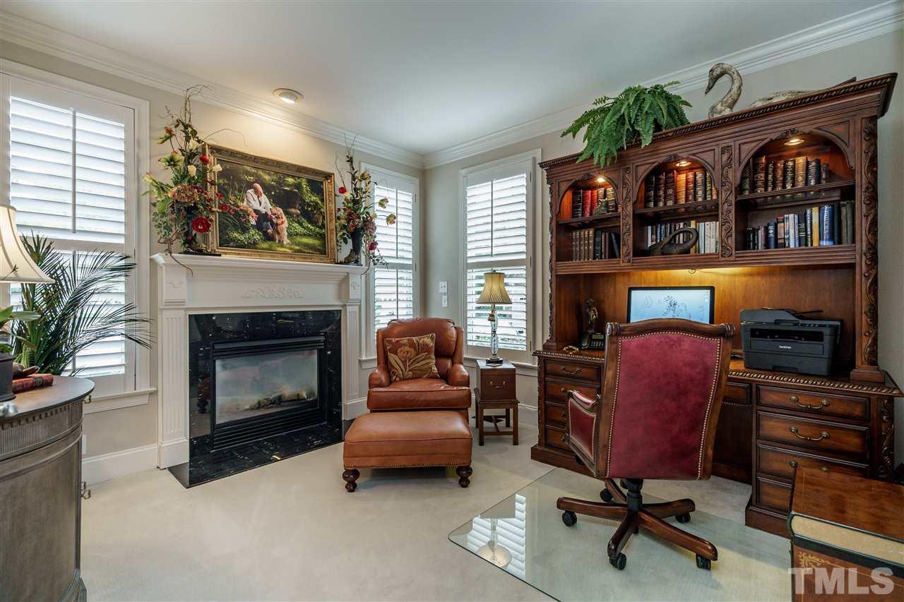 1901 Torrington Street Raleigh, NC 27615 - Photo 6 of 30 a living room with furniture and a fireplace